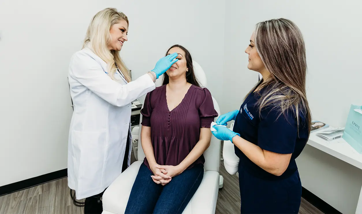 Dr. Melyssa Hancock - at female patient treatment