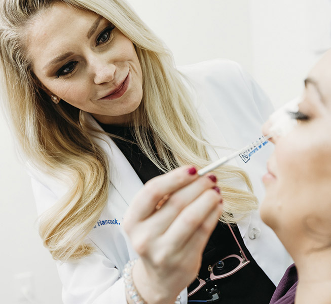 treatment for empty nose syndrome: dr. hancock evaluating a female patient's nose